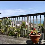 Fantastic Spacious House With Beautiful Panoramic Views Of The Bay Only A Few Minutes Walk From Beach Harbour And Restaurants This House Has 3 Bedrooms 3 Bathrooms And 2 Lovely Sitting Rooms