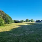 Shepherds Hut Surrounded By Fields And The Jurassic Coast