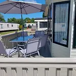 A Fashionable Caravan In A Peaceful Seaside Town
