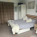 We Have 2 Rooms To Offer At Our Home - There Is A Very Large Downstairs Bedroom With Ensuite Or A Beautiful Bar B Q Lodge With 4 Sleeping Platforms With Its Own Separate Toilet And Shower Facility Opposite The Lodge - Please Book The Room You Want