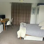 We Have 2 Rooms To Offer At Our Home - There Is A Very Large Downstairs Bedroom With Ensuite Or A Beautiful Bar B Q Lodge With 4 Sleeping Platforms With Its Own Separate Toilet And Shower Facility Opposite The Lodge - Please Book The Room You Want